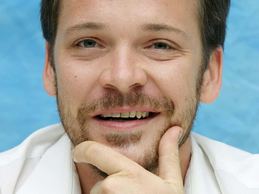 Actor Peter Sarsgaard Poses For Cameras On The Red Carpet. Wallpaper