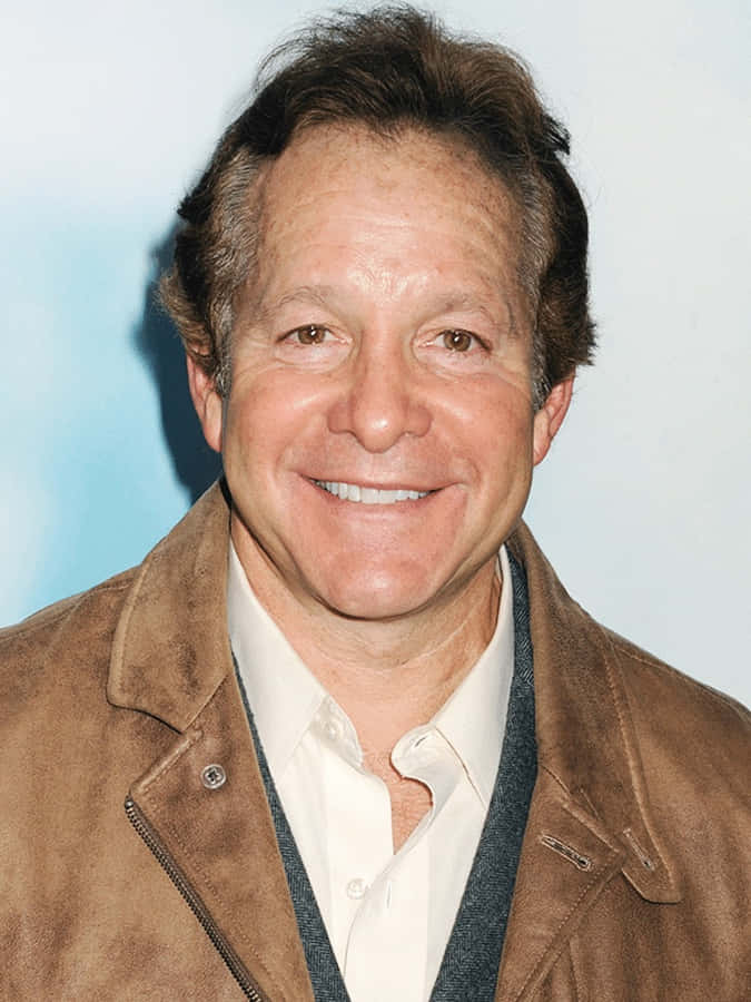 Actor Steve Guttenberg Looking Dapper In A Grey Suit. Wallpaper