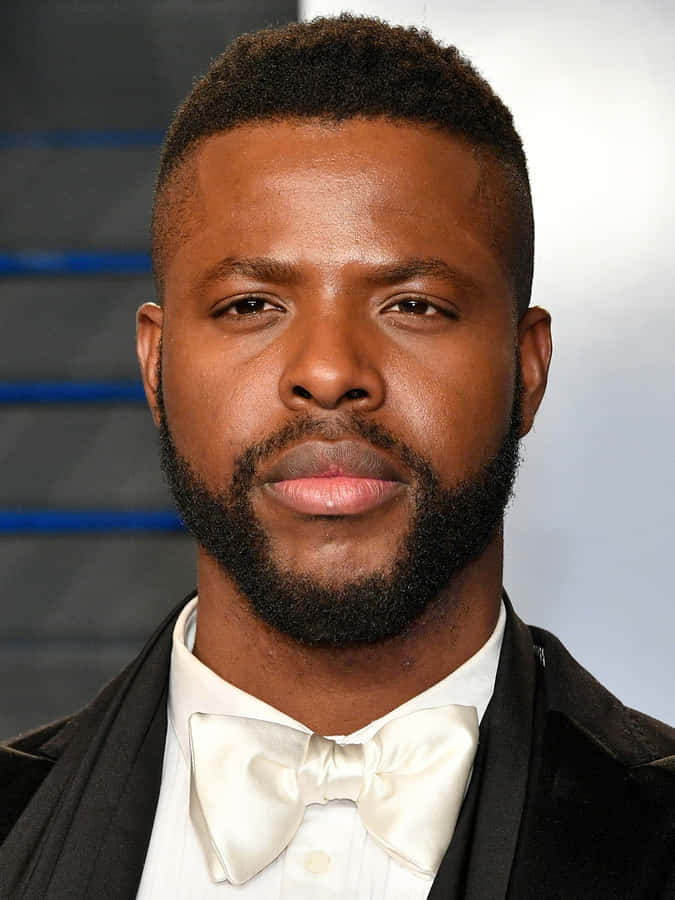 Actor Winston Duke Smiles For The Camera. Wallpaper