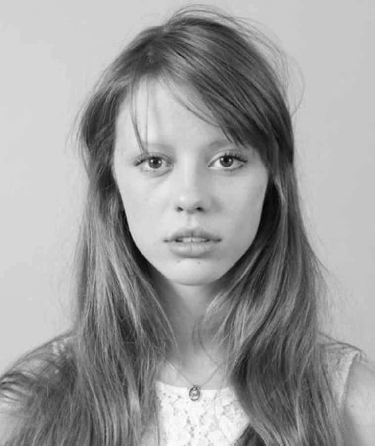 Actress Mia Goth's Radiant Candid Shot Wallpaper