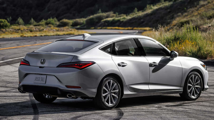 Acura Integra Sport Coupe In A Picturesque Setting Wallpaper