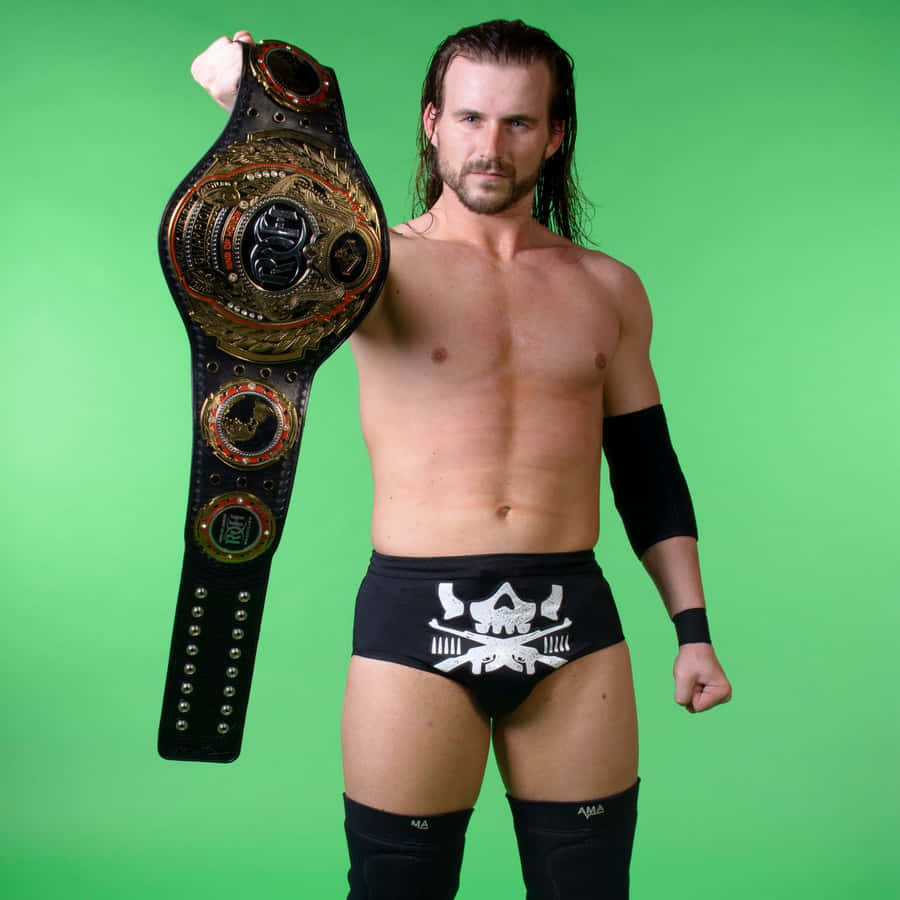 Adam Cole Holding His Championship Belt Wallpaper