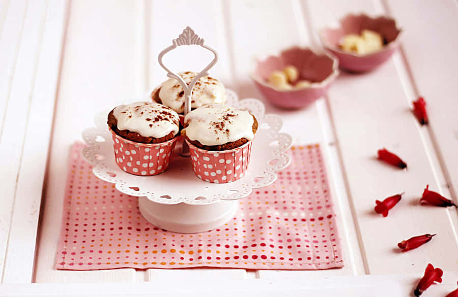 Adorable Pink Cupcake On A Plate Wallpaper