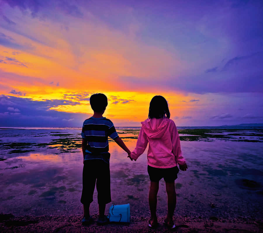 Adorable Smiling Children Enjoying The Outdoors Together Wallpaper
