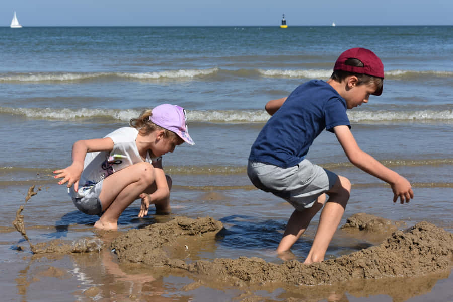 Adorable Smiling Kids Playing Together Outdoors Wallpaper