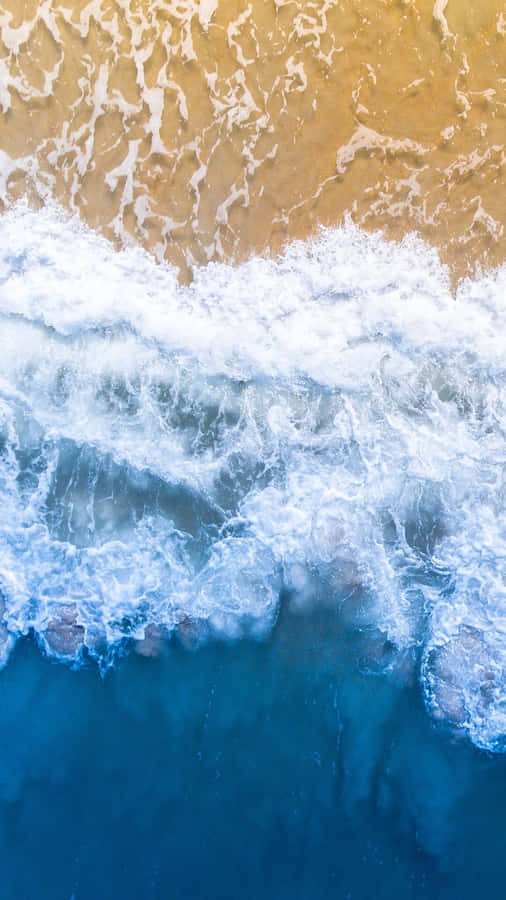 Aerial View Blue Ocean Waves Crashing Wallpaper