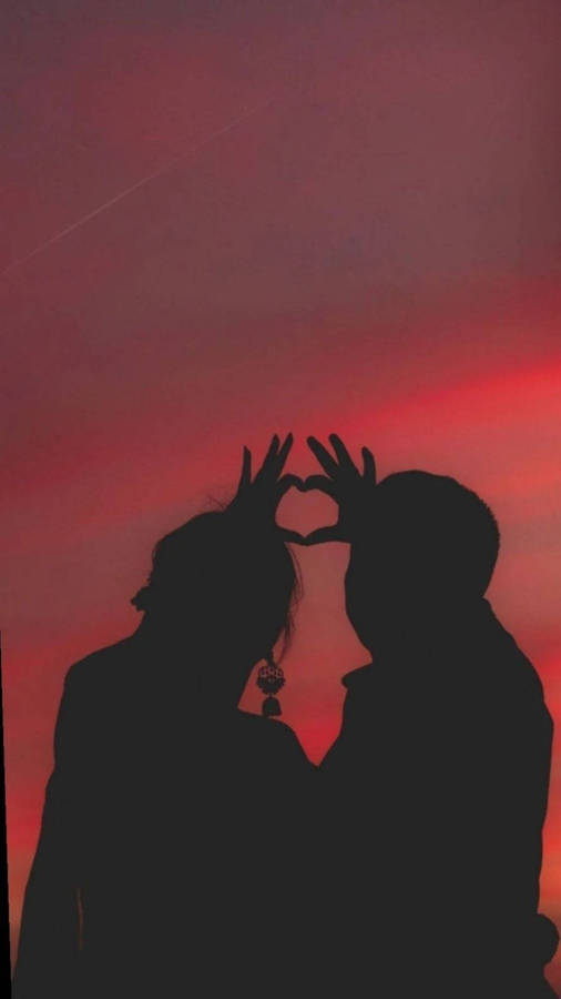 Aesthetic Couple With Red Sky Wallpaper