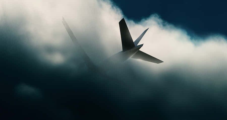 Airplane Disappearing Into Clouds Wallpaper