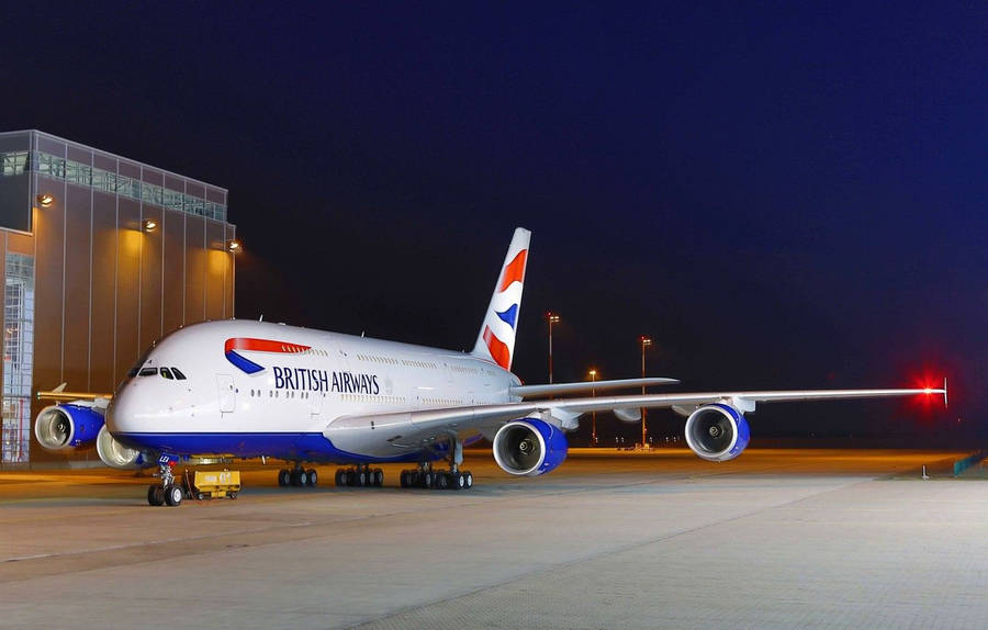 Airplane From British Airways Parked On Runway Wallpaper