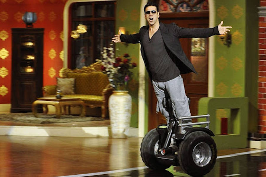 Akshay Kumar Riding Segway Scooter Wallpaper