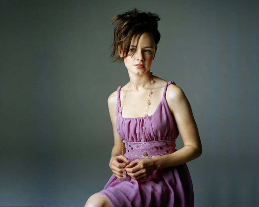 Alexis Bledel Striking A Pose In An Elegant Outfit Wallpaper