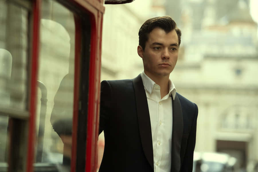 Alfred Pennyworth, The Devoted Butler Of Batman, Standing With Confidence And Intelligence Wallpaper