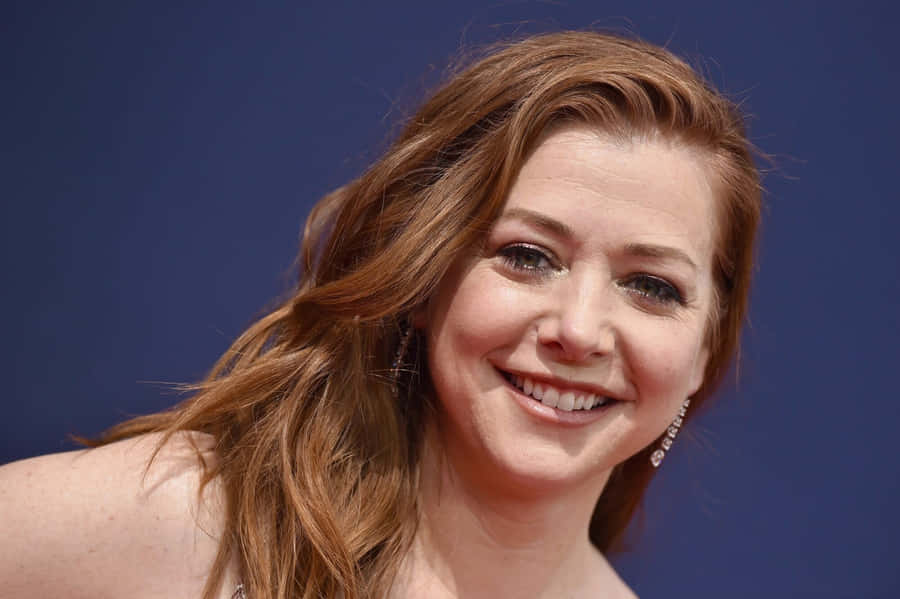Alyson Hannigan Smiling Beautifully In A Candid Moment Wallpaper