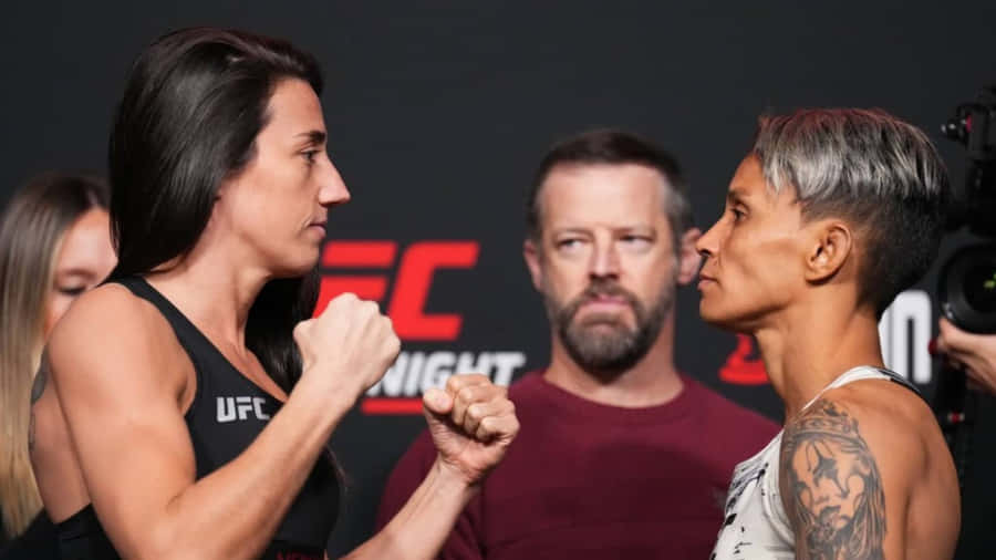 Amanda Lemos Showcasing Her Championship Spirit In The Mma Ring Wallpaper