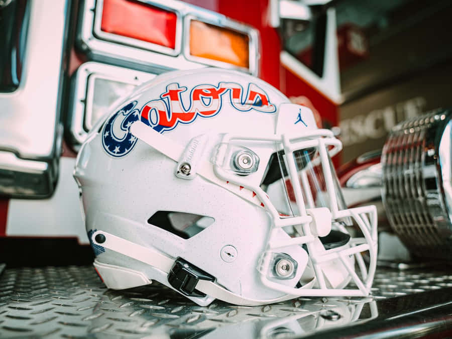 'american Football Helmet On Field' Wallpaper