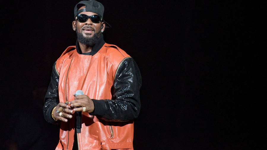 American Singer R Kelly In Orange Jacket Wallpaper