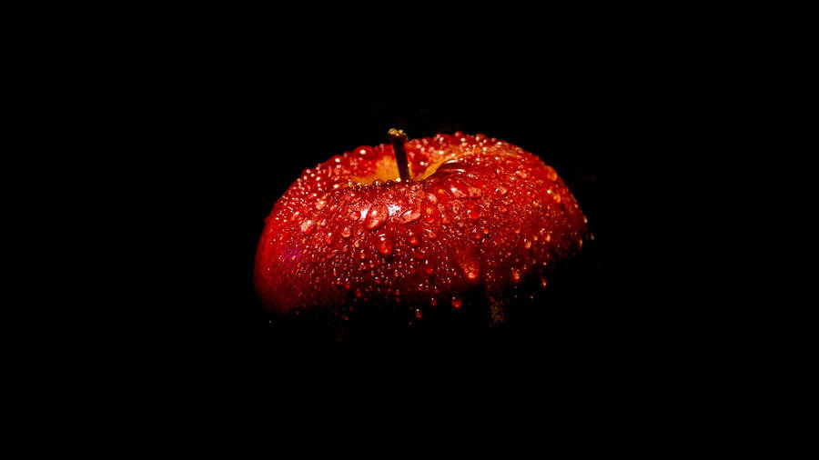 An Apple With Water Drops On It Wallpaper