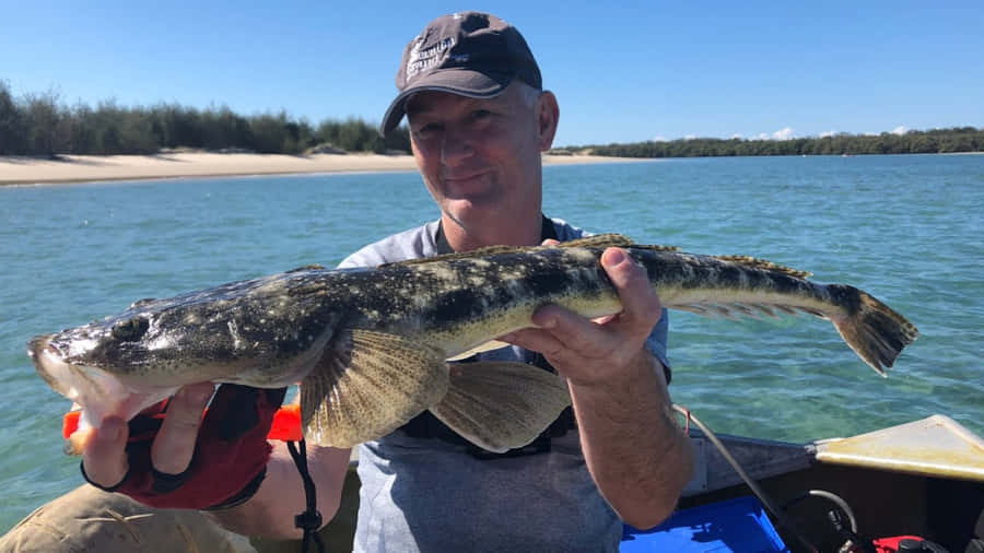 Anglerwith Flathead Catch.jpg Wallpaper