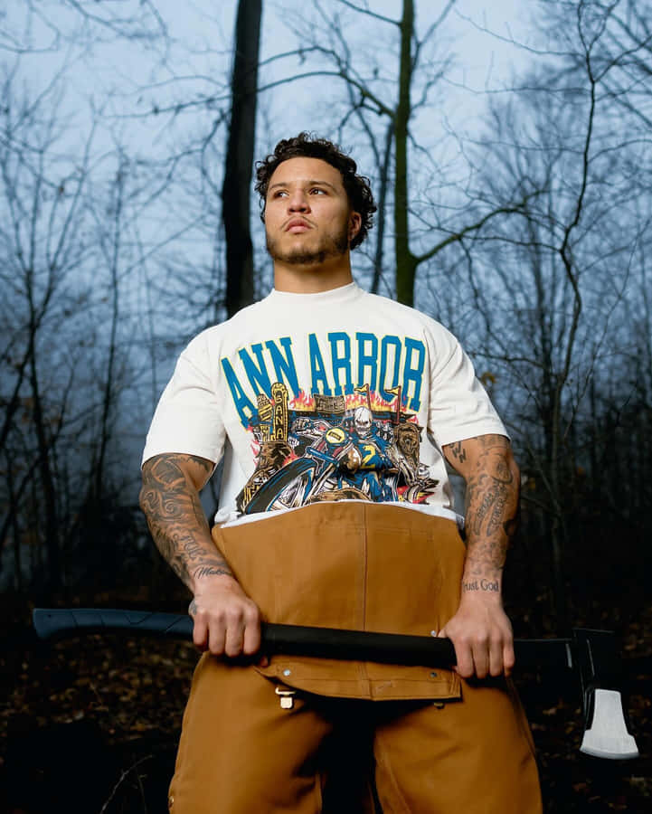 Ann Arbor Themed Tattooed Manwith Axe Wallpaper