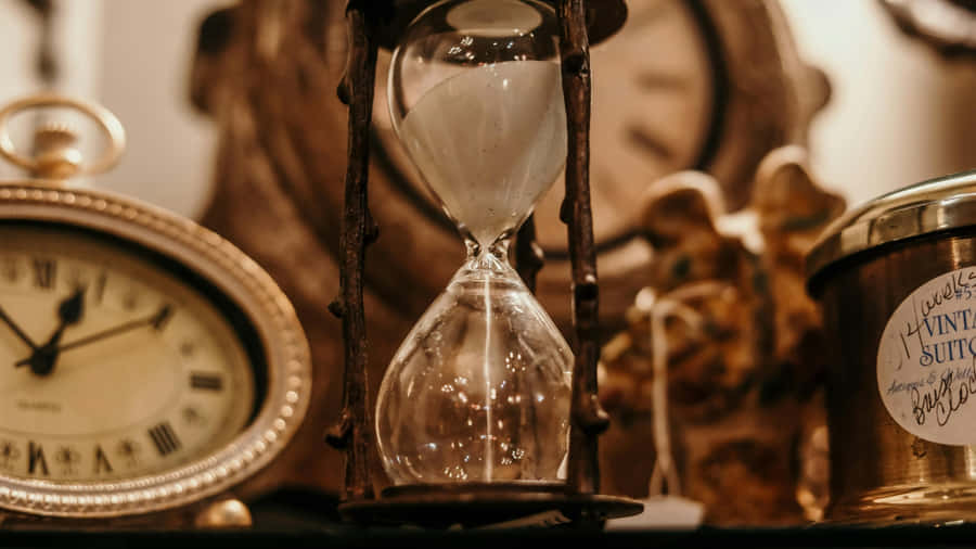 Antique Timepieces And Hourglass Wallpaper