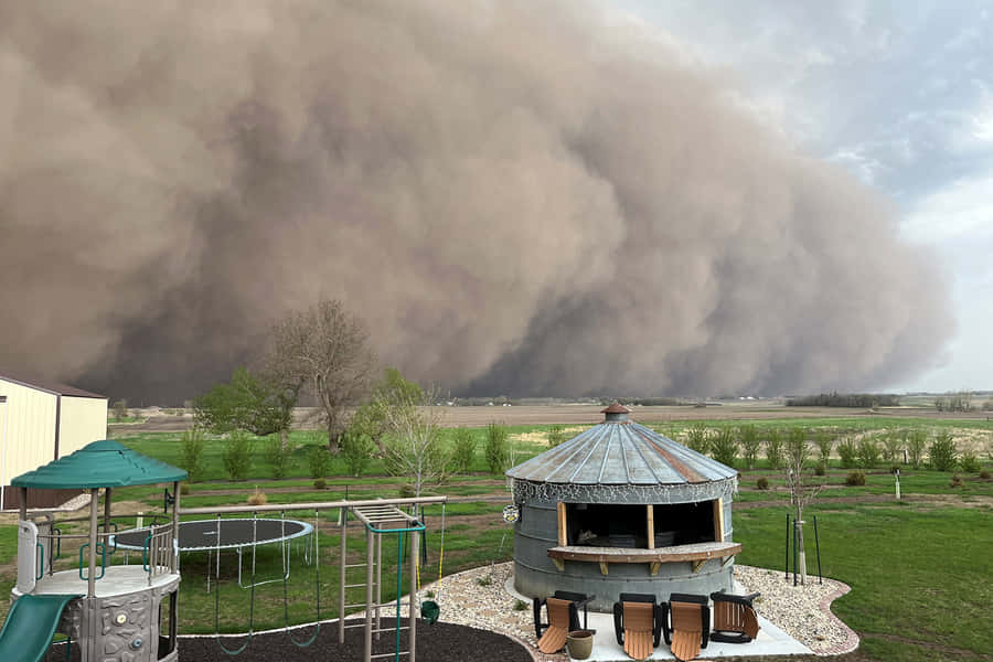 Approaching Dust Storm Over Residential Area Wallpaper