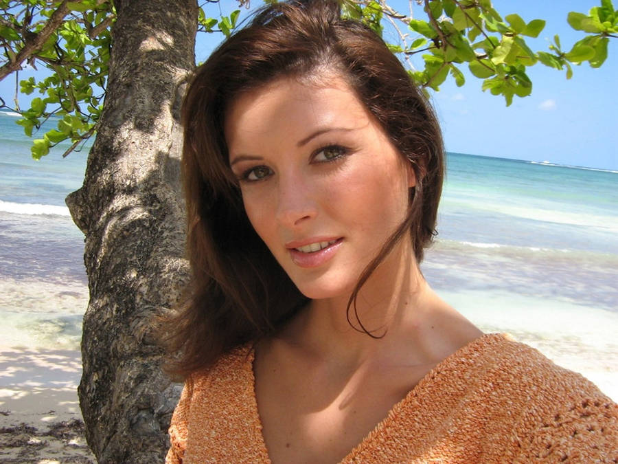 April Bowlby Near A Tree At The Beach Wallpaper