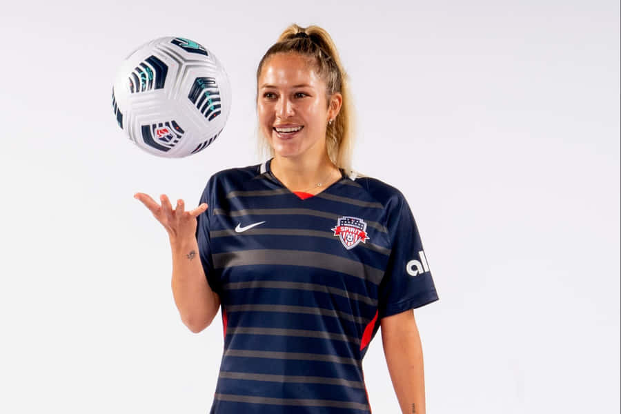 Ashley Sanchez In Action During A Football Match Wallpaper