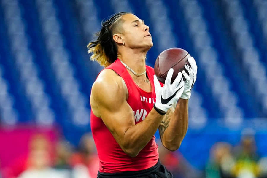 Athlete Catching Football During Drill Wallpaper