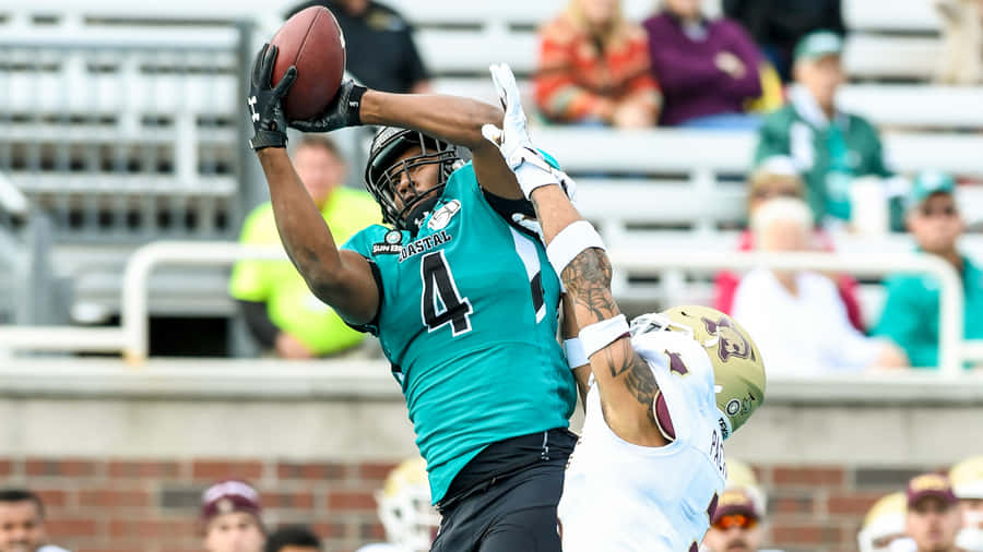 Athletic Catch Football Game Wallpaper