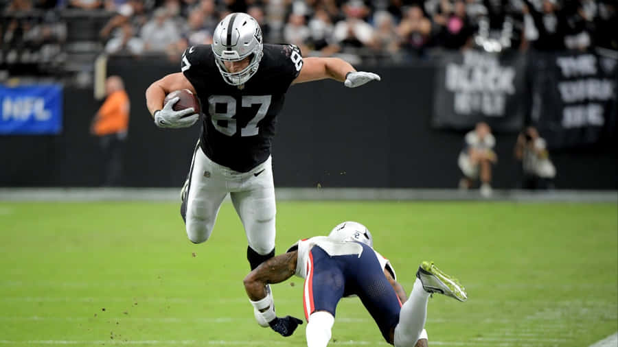 Athletic Football Catch Moment Wallpaper