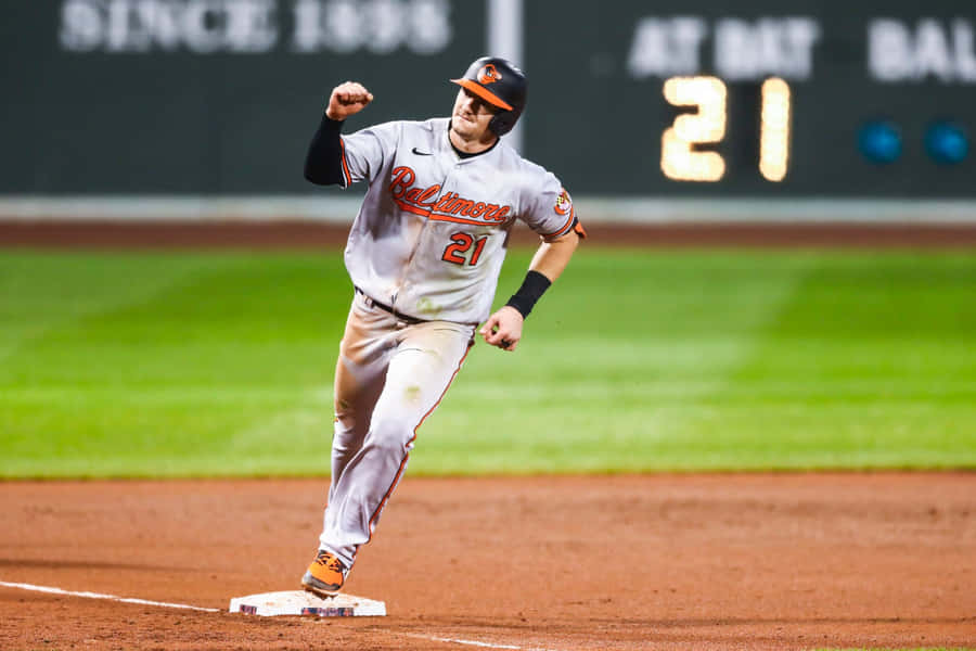 Austin Hays In Action During A Baseball Game Wallpaper