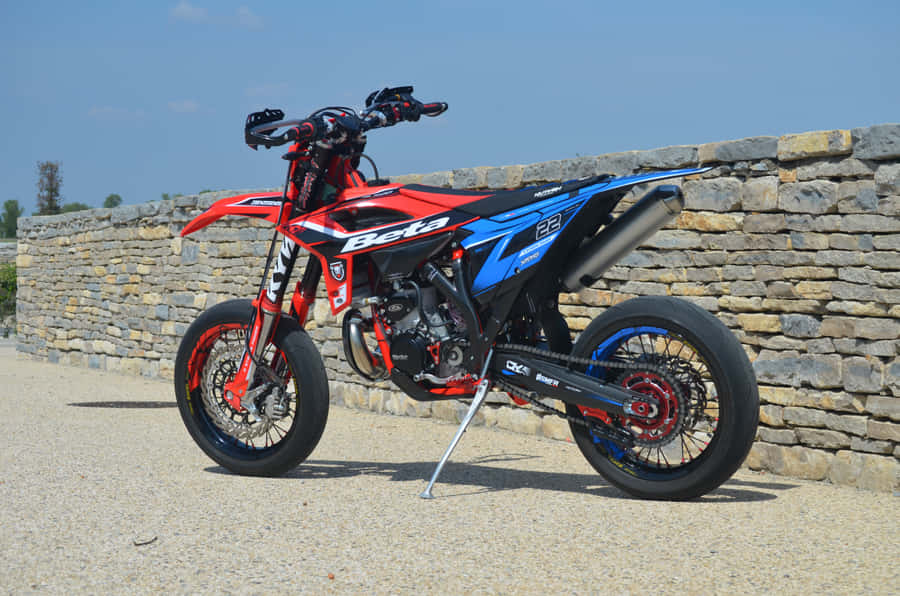 Awe-inspiring Beta Motorcycle In Raw Action Wallpaper