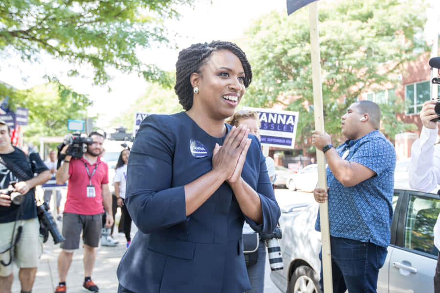 Ayanna Pressley Engaging With Public Business Outside Wallpaper