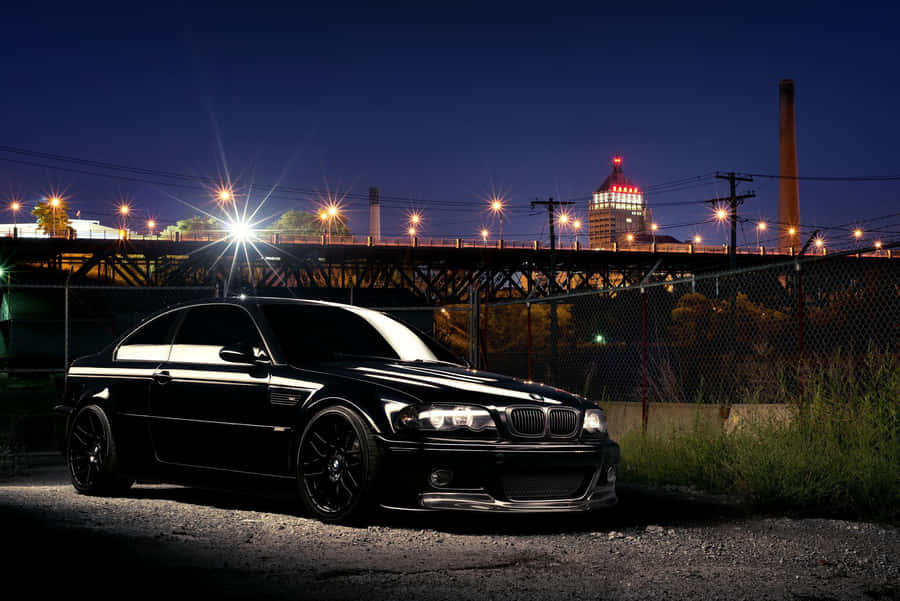 B M W E46 Nighttime Urban Backdrop Wallpaper