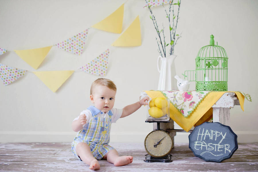 Baby Boy With Glass Of Lemons Wallpaper
