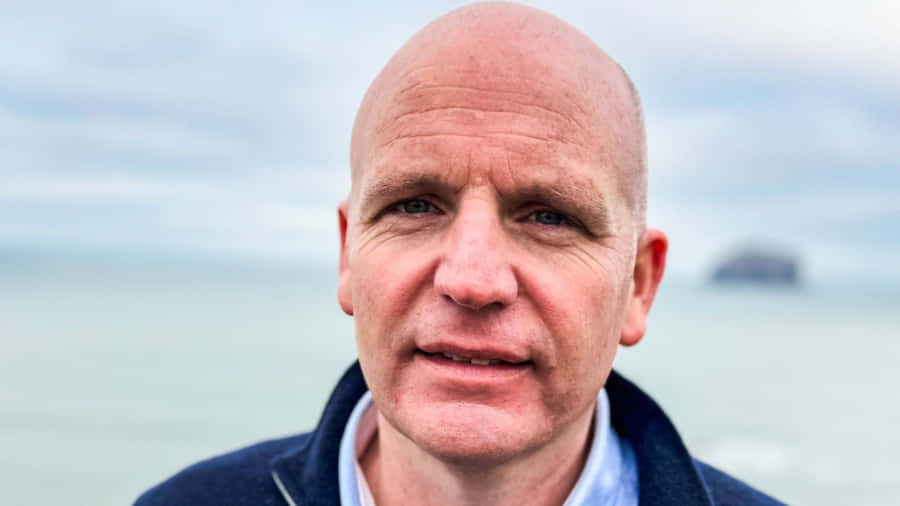 Bald Man Seaside Portrait Wallpaper