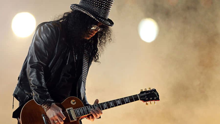 Band Member Of Estranged Showcasing His Passion For Music Wallpaper