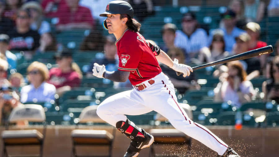 Baseball Player Hitting Ball Dynamic Swing Wallpaper