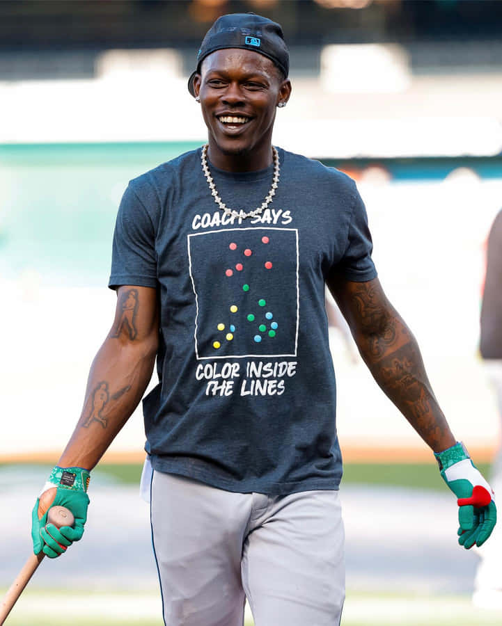 Baseball Player Smiling With Bat Wallpaper