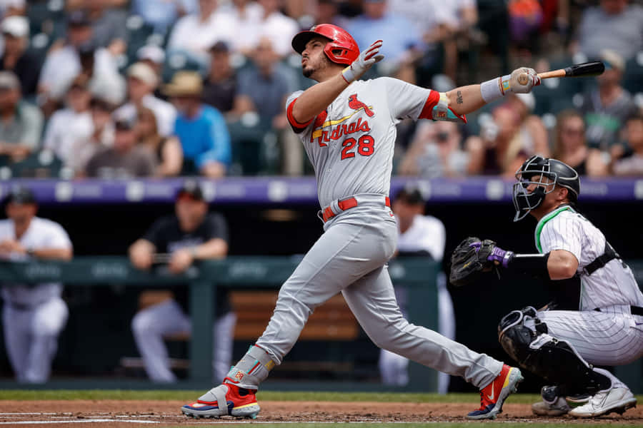 Baseball Player Swinging Bat Action Shot Wallpaper