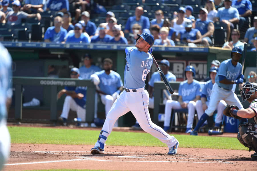 Baseball Player Swinging Bat Wallpaper