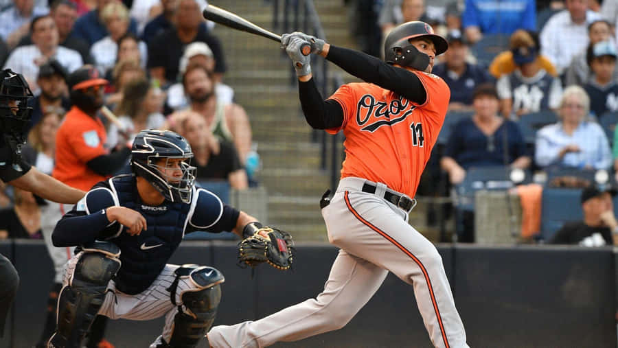 Baseball Player Swinging Bat Wallpaper