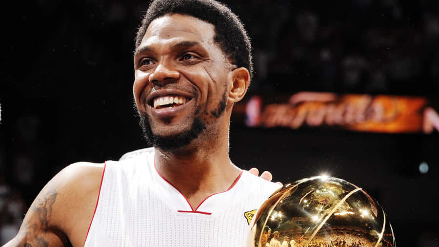 Basketball Champion Smiling With Trophy.jpg Wallpaper