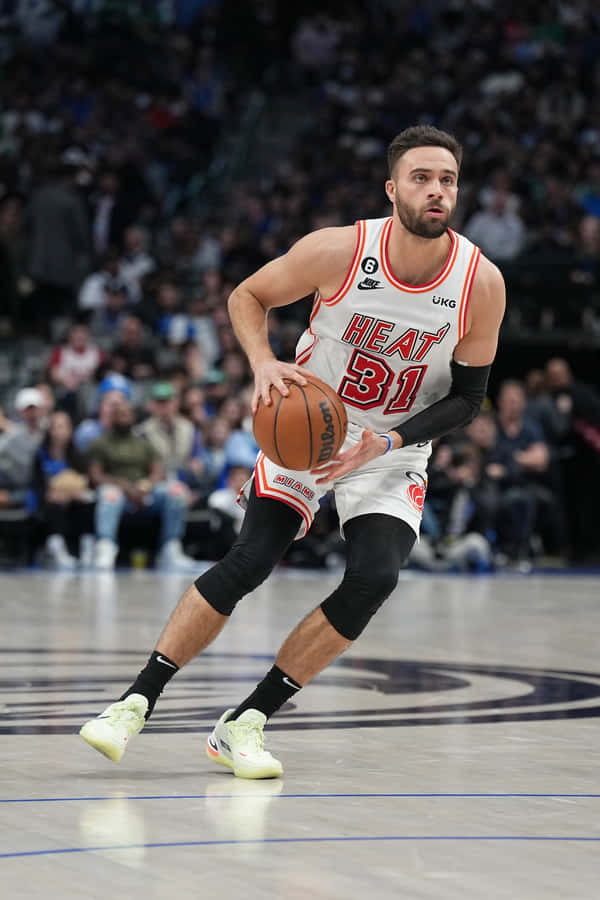 Basketball Player In Action Miami Heat Uniform Wallpaper