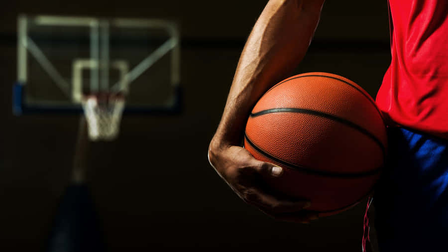 Basketball Player Taking A Three-point Shot Wallpaper