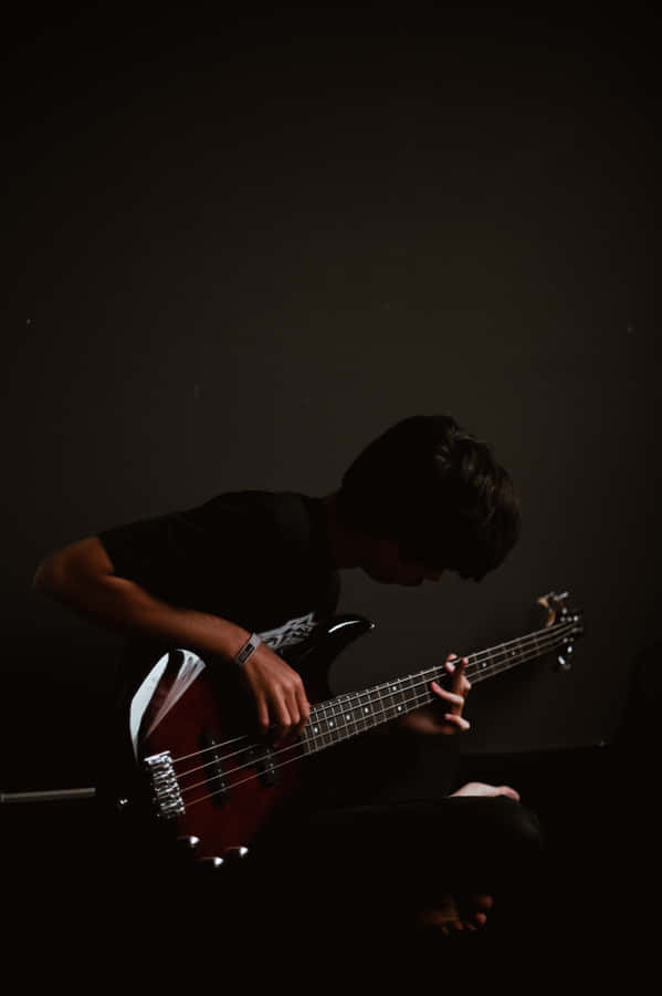 Bass Guitar Play Boy Dark Mobile Wallpaper