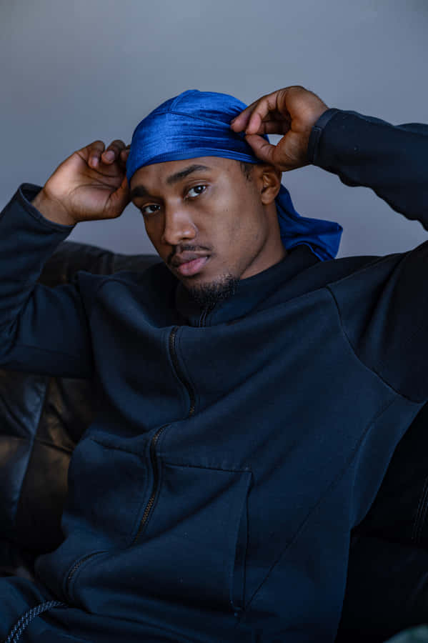 Be Confident And Stylish In An Navy Blue Jacket Wallpaper