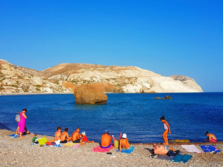 Beach In Paphos With Many People Wallpaper