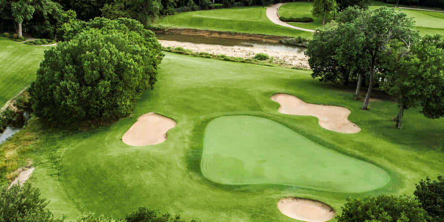 Beautiful Golf Course On A Sunny Day Wallpaper