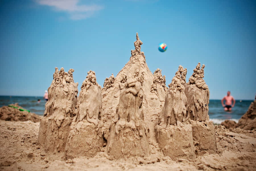 Beautiful Sandcastles On A Sunny Beach Wallpaper